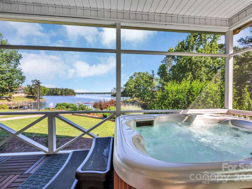 2102 Lake Road, Ridgeway, SC 29130.  MLS# CAR4256737, YatesRealty ID 16450. Soak in the hot tub on a cool fall evening.
