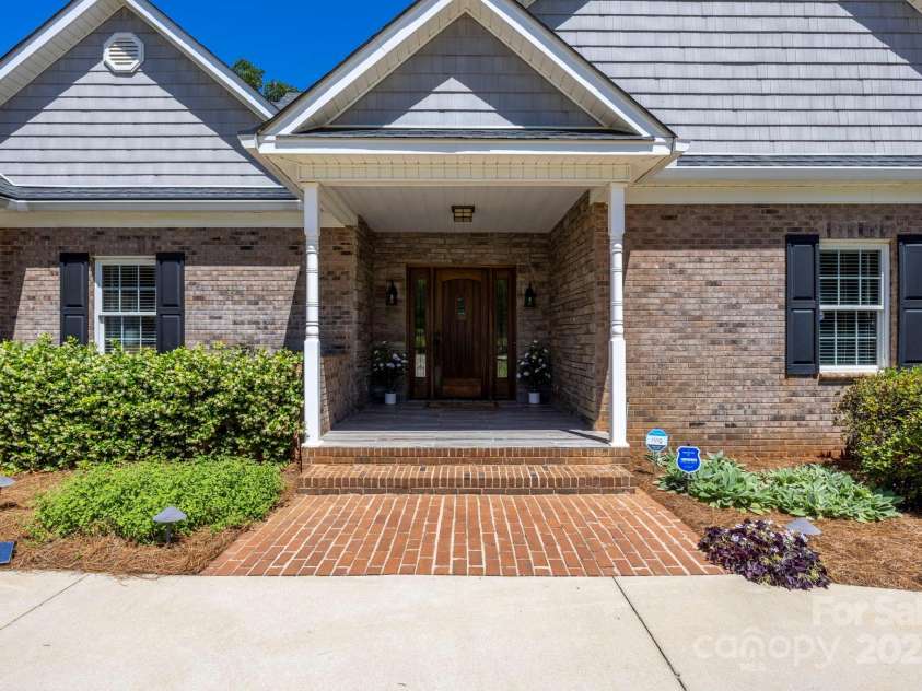 2102 Lake Road, Ridgeway, SC 29130.  MLS# CAR4256737, YatesRealty ID 16450. Stone accents on the front porch and beautiful wood door.