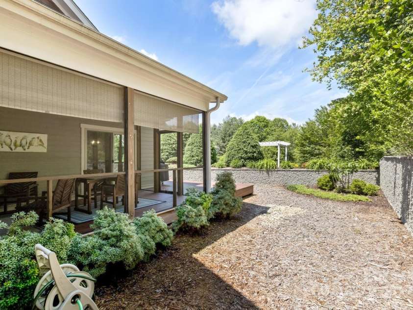 140 Shadowleaf Drive, Hendersonville, NC 28739.  MLS# CAR4254625, YatesRealty ID 16452. Back & side yard