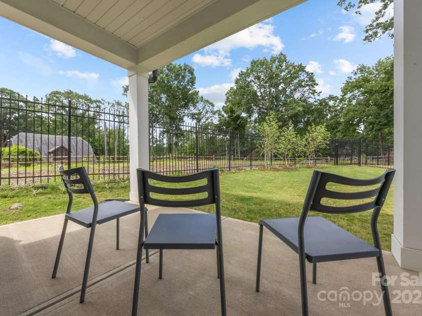 6032 Corbin Woods Court, Charlotte, NC 28226.  MLS# CAR4263567, YatesRealty ID 16456. Covered Back Patio