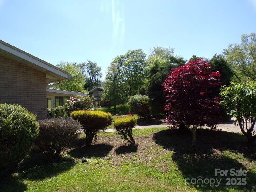 51 Fletcher View Drive, Fletcher, NC 28732.  MLS# CAR4252220, YatesRealty ID 16467. Side yard