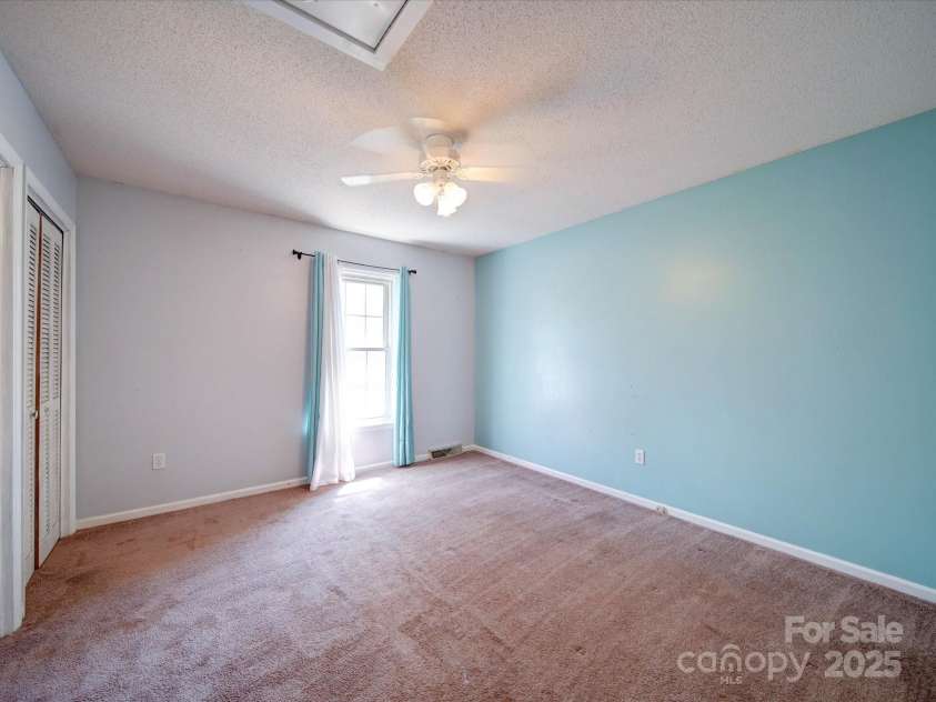 3530 Farm Lake Drive, Concord, NC 28027.  MLS# CAR4246396, YatesRealty ID 16470. 2nd Guest Bedroom has Carpet and a Ceiling Fan/Light