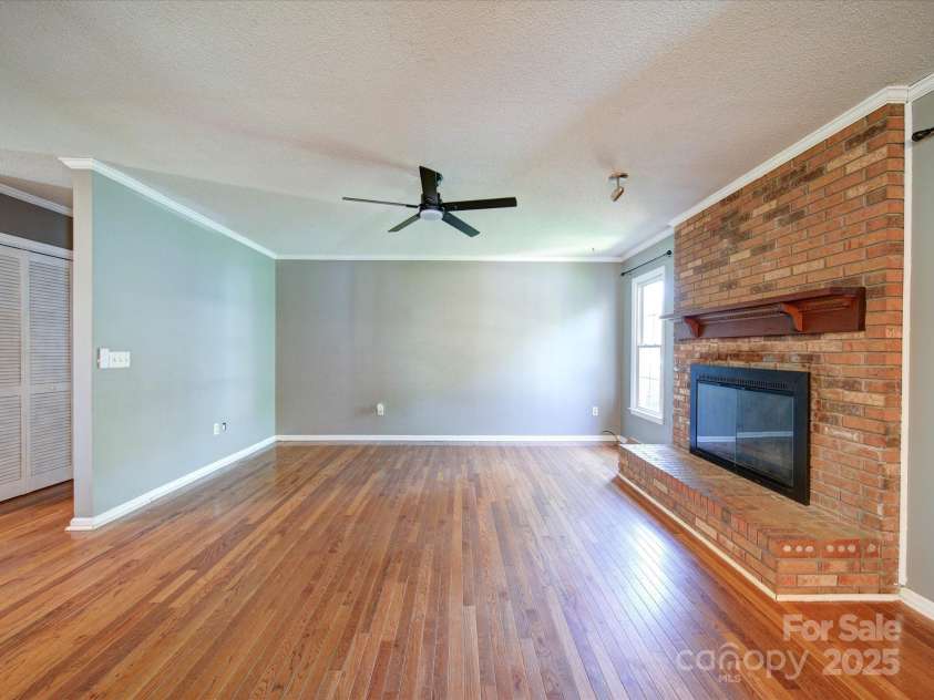 3530 Farm Lake Drive, Concord, NC 28027.  MLS# CAR4246396, YatesRealty ID 16470. Another picture of the Great Room. Notice the Full Brick Wood Burning Fireplace.