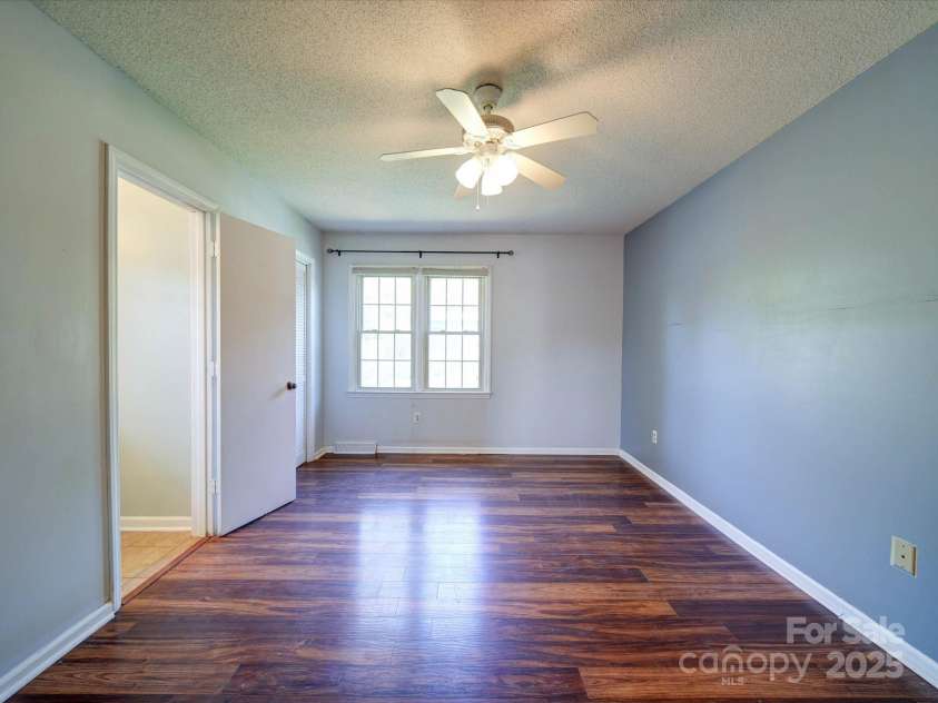 3530 Farm Lake Drive, Concord, NC 28027.  MLS# CAR4246396, YatesRealty ID 16470. The Owners Bedroom Features Wide Plank Pre-Finished Wood Floors.