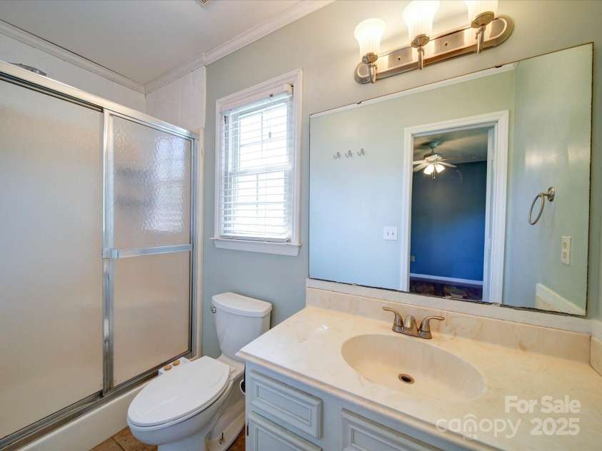 3530 Farm Lake Drive, Concord, NC 28027.  MLS# CAR4246396, YatesRealty ID 16470. The Owners Suite Bathroom features a Single Sink Vanity and a Large Step in Shower.