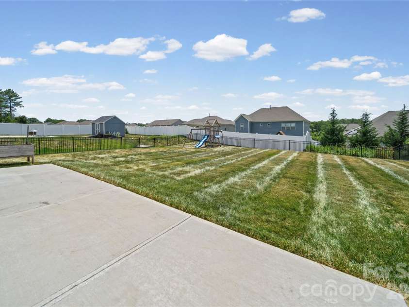 10054 Carousel Corral Drive, Midland, NC 28107.  MLS# CAR4361026, YatesRealty ID 16472. Large Flat back yard ready for your plans!