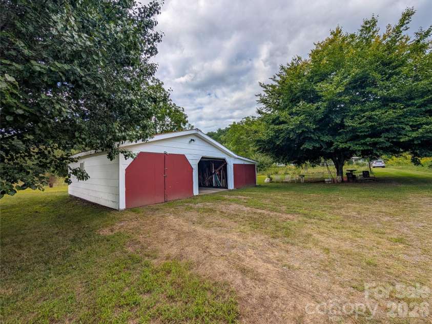 165 Cattail Creek Road, Burnsville, NC 28714.  MLS# CAR4298888, YatesRealty ID 16473. Two Car Garage with extra storage - great workshop or studio potential!