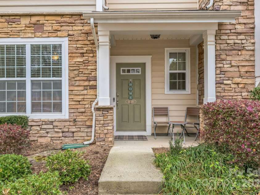 8009 Whitehawk Hill Road, Waxhaw, NC 28173.  MLS# CAR4232872, YatesRealty ID 16475. Covered front porch with seating area.