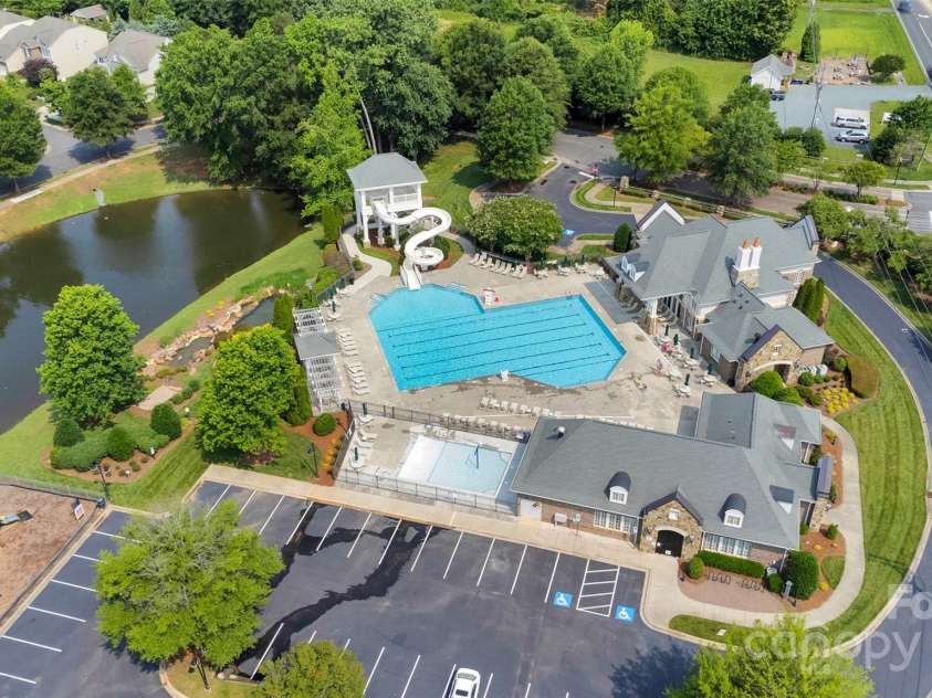 8009 Whitehawk Hill Road, Waxhaw, NC 28173.  MLS# CAR4232872, YatesRealty ID 16475. Resort-style community clubhouse, pool, playground and pond.