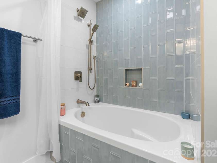 353 Olivet Lane, Fletcher, NC 28732.  MLS# CAR4226055, YatesRealty ID 16483. Basement bath large soaking tub