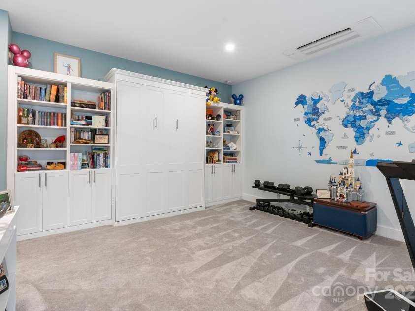 353 Olivet Lane, Fletcher, NC 28732.  MLS# CAR4226055, YatesRealty ID 16483. Basement den with murphy bed