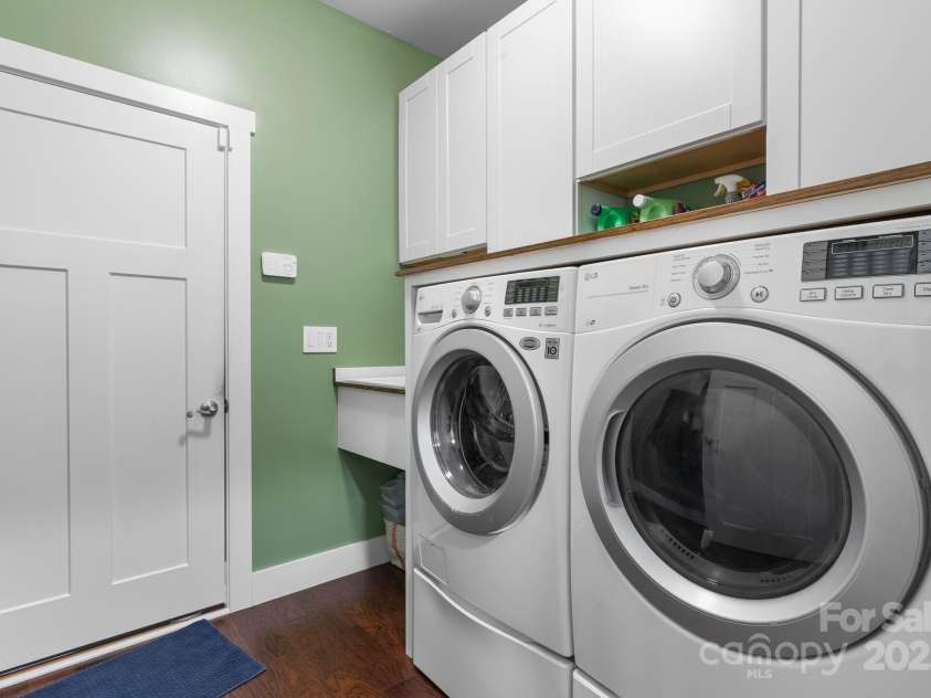 353 Olivet Lane, Fletcher, NC 28732.  MLS# CAR4226055, YatesRealty ID 16483. Laundry room with sink and cabinets