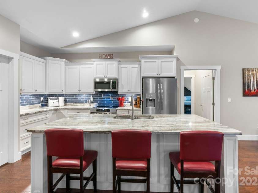 353 Olivet Lane, Fletcher, NC 28732.  MLS# CAR4226055, YatesRealty ID 16483. Modern Kitchen open to dining and living room