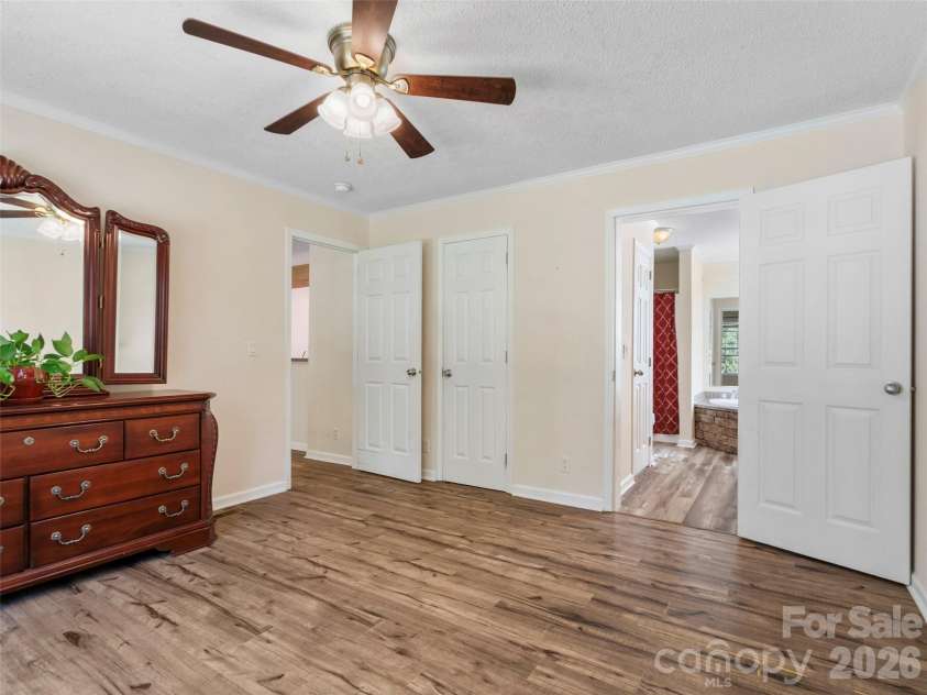 9 Sun Ridge Road, Asheville, NC 28806.  MLS# CAR4294387, YatesRealty ID 16484. Primary Bedroom and entrance into primary bath