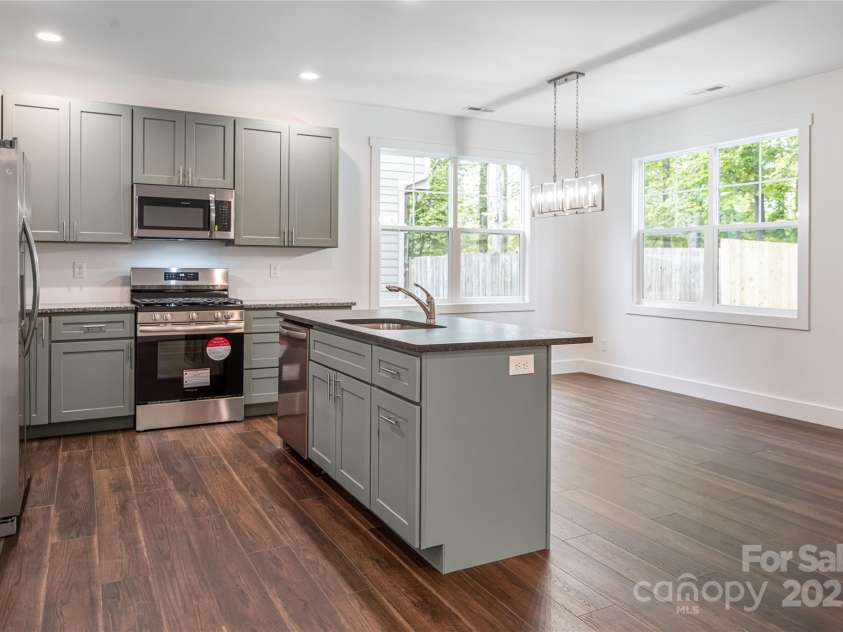 15 Myrtle Lee Cove, Arden, NC 28704.  MLS# CAR4254798, YatesRealty ID 16491. Open concept kitchen dining area
