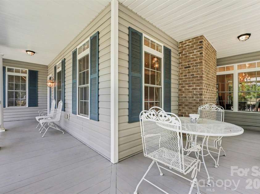 6301 Hawk Nest Drive, Concord, NC 28027.  MLS# CAR4374191, YatesRealty ID 16495. Beautiful wrap around porch