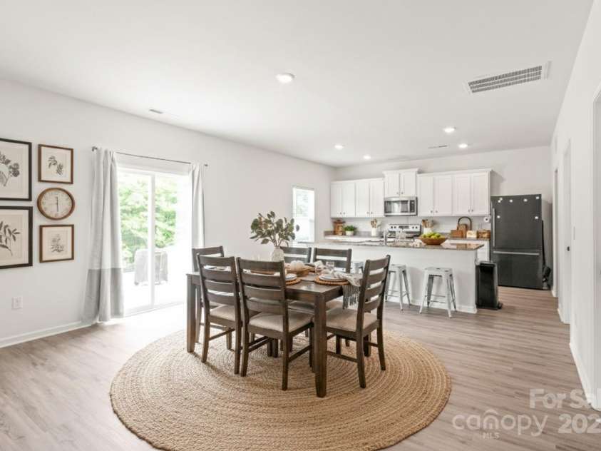2340 Lanza Drive, Charlotte, NC 28215.  MLS# CAR4264473, YatesRealty ID 16500. Dining Area and Kitchen - Virtually Staged with Decor