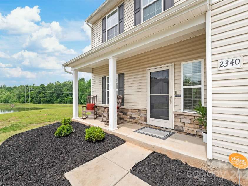 2340 Lanza Drive, Charlotte, NC 28215.  MLS# CAR4264473, YatesRealty ID 16500. Front Porch Overlooking Pond