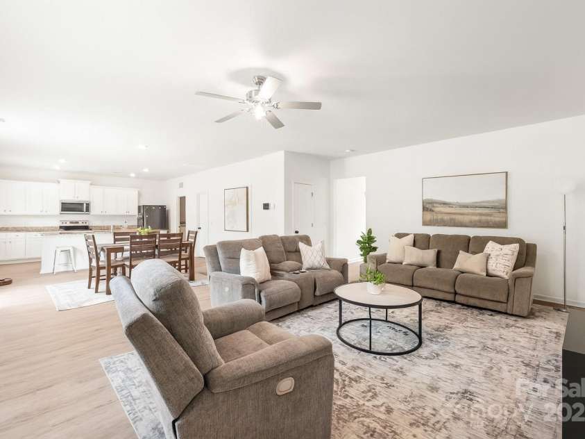 2340 Lanza Drive, Charlotte, NC 28215.  MLS# CAR4264473, YatesRealty ID 16500. Living Room into Dining - Virtually Staged with Decor