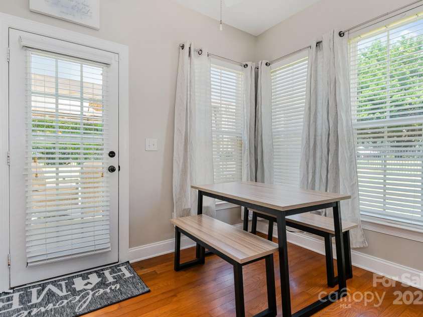 9588 Marquette Street, Concord, NC 28027.  MLS# CAR4252486, YatesRealty ID 16506. Breakfast sunroom area