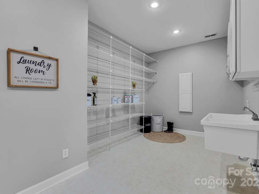 271 Lockhard Circle, Troutman, NC 28166.  MLS# CAR4194496, YatesRealty ID 16508. THE MASSIVE LAUNDRY ROOM PROVIDES A GREAT SPACE FOR STORAGE, TOO!