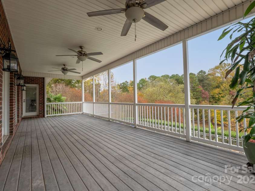 271 Lockhard Circle, Troutman, NC 28166.  MLS# CAR4194496, YatesRealty ID 16508. The massive main level deck provides a breezy, shaded space to take in the natural surroundings of your new home