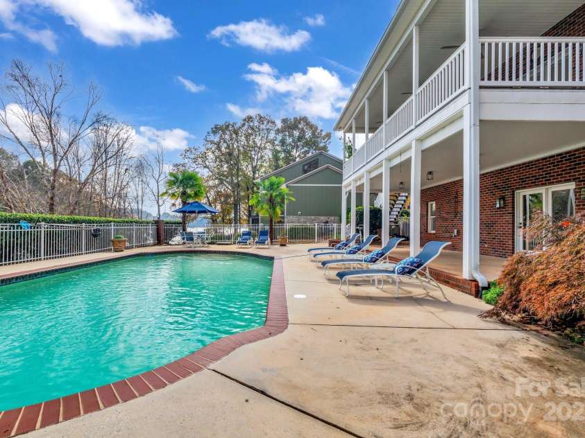271 Lockhard Circle, Troutman, NC 28166.  MLS# CAR4194496, YatesRealty ID 16508. THE POOL IS FULLY FENCED-IN AND SURROUNDED BY A LARGE PATIO