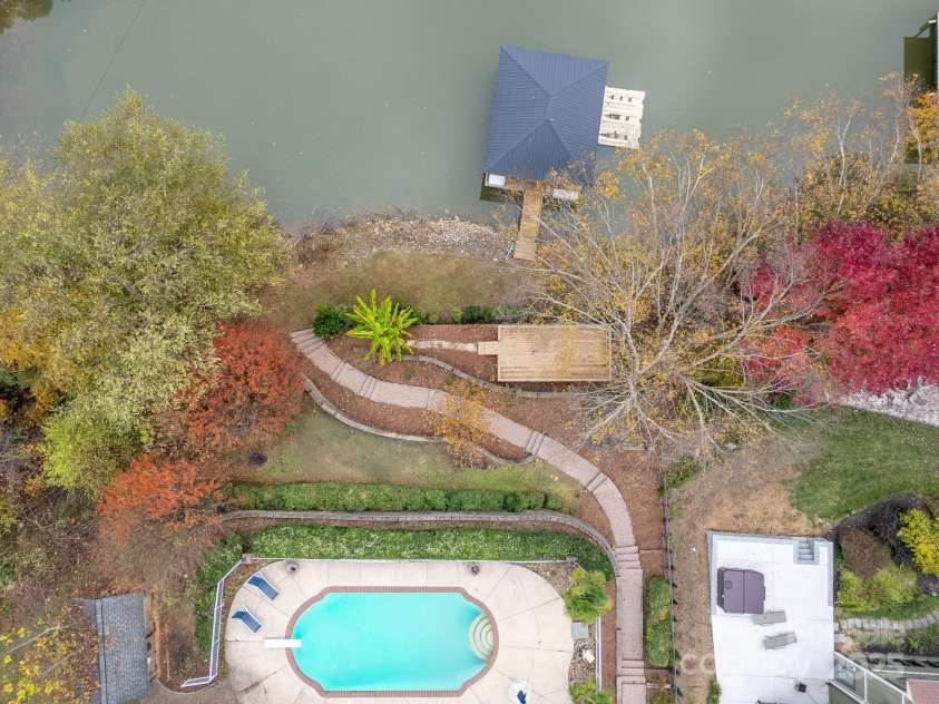 271 Lockhard Circle, Troutman, NC 28166.  MLS# CAR4194496, YatesRealty ID 16508. THIS SPRAWLING LAKE-FRONT PROPERTY OFFERS AN IN-GROUND POOL AND A COVERED, DEEDED DOCK W/ BOAT LIFT AND ADDITIONAL DECK RIGHGT BY THE DOCK, TOO!