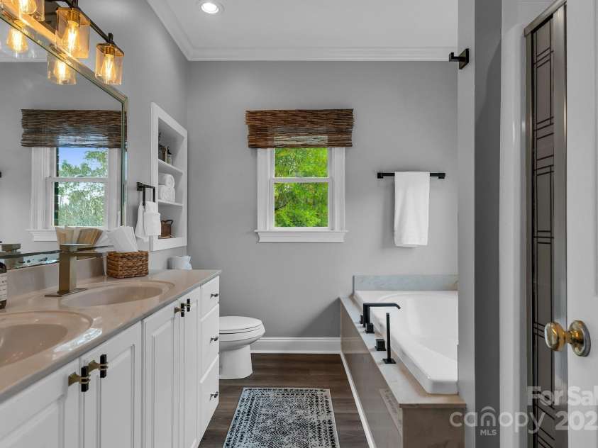 271 Lockhard Circle, Troutman, NC 28166.  MLS# CAR4194496, YatesRealty ID 16508. YOUR PRIMARY BATHROOM INCLUDES DUAL VANITIES, A LUXURIOUS ROMAN TUB AND WALK-IN SHOWER