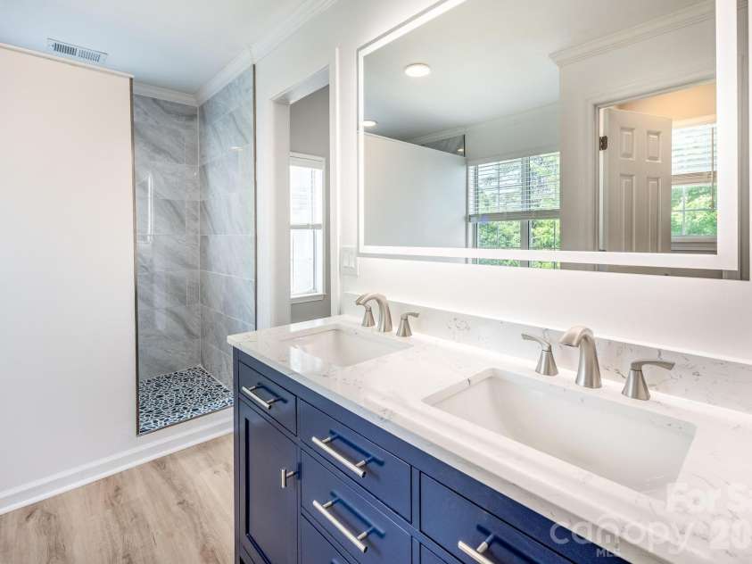 107 Monterey Drive, Mooresville, NC 28117.  MLS# CAR4372310, YatesRealty ID 16510. Lighted mirror in Primary Bath