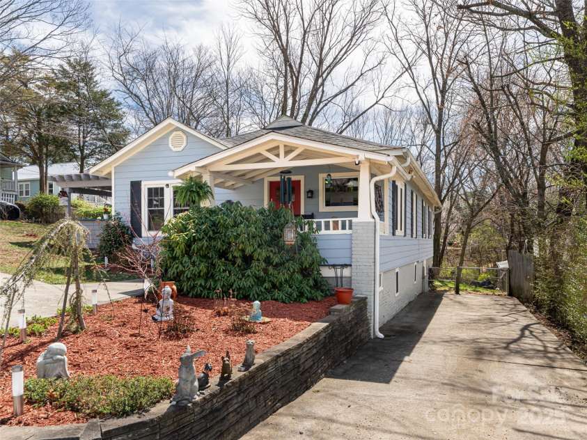 7 Temple Avenue, Asheville, NC 28804.  MLS# CAR4237775, YatesRealty ID 16513. Front, right of the house with additional parking area. 