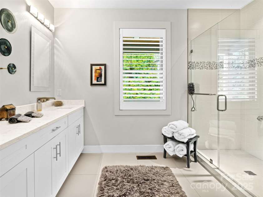 40 Overlook Road, Asheville, NC 28803.  MLS# CAR4300560, YatesRealty ID 16528. Spa-inspired bath featuring an oversized walk-in shower and luxurious finishes.