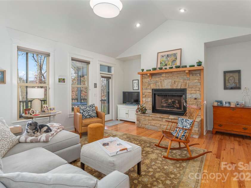 95 Greenwells Glory Drive, Biltmore Lake, NC 28715.  MLS# CAR4247434, YatesRealty ID 16530. Gas fireplace with stone hearth