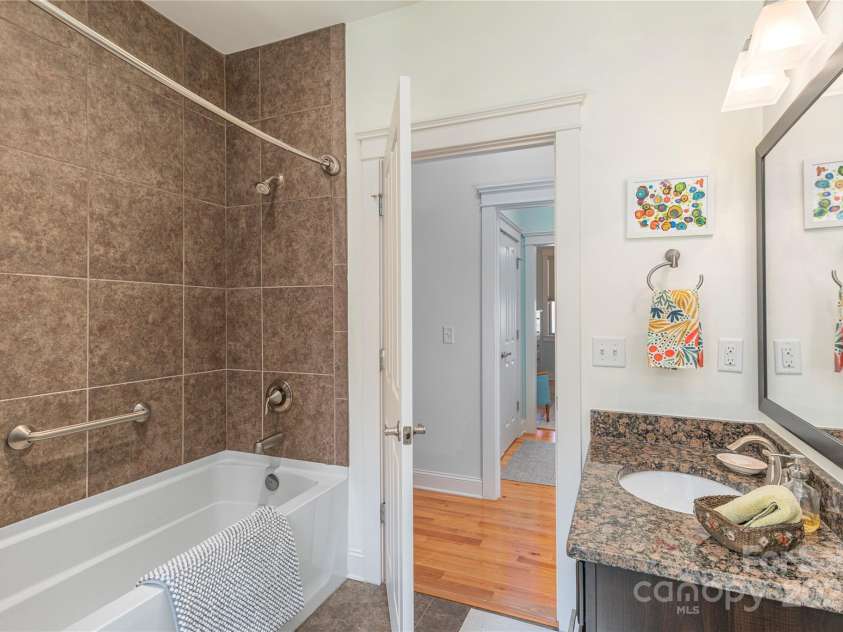 95 Greenwells Glory Drive, Biltmore Lake, NC 28715.  MLS# CAR4247434, YatesRealty ID 16530. Secondary bathroom with tiled walls
