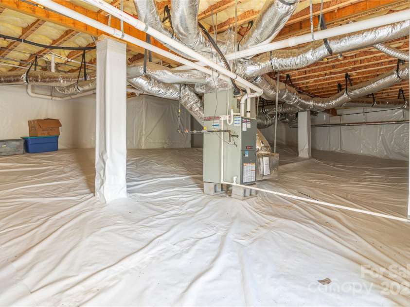 95 Greenwells Glory Drive, Biltmore Lake, NC 28715.  MLS# CAR4247434, YatesRealty ID 16530. Walk in crawl space for storage