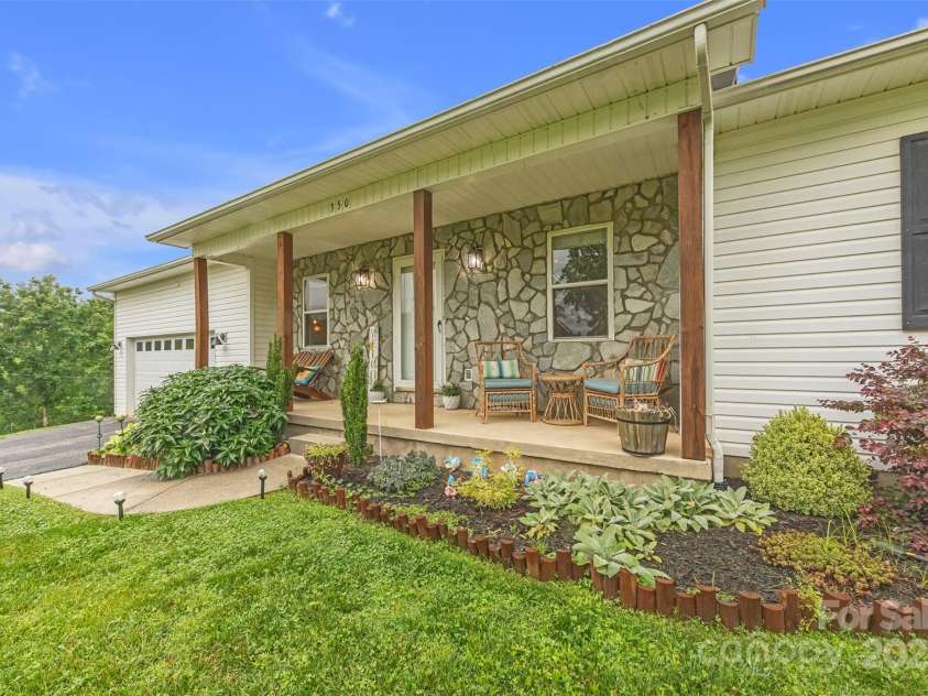 350 Moose Drive, Stony Point, NC 28678.  MLS# CAR4263053, YatesRealty ID 16547. Spacious front porch with beautiful landscaping