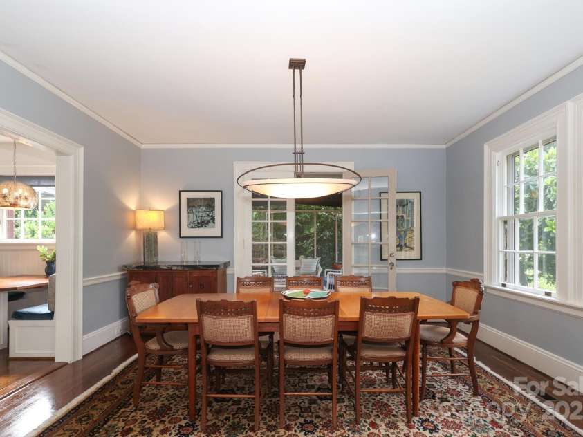 801 Berkeley Avenue, Charlotte, NC 28203.  MLS# CAR4243882, YatesRealty ID 16552. Dining room with view to screened porch and breakfast nook