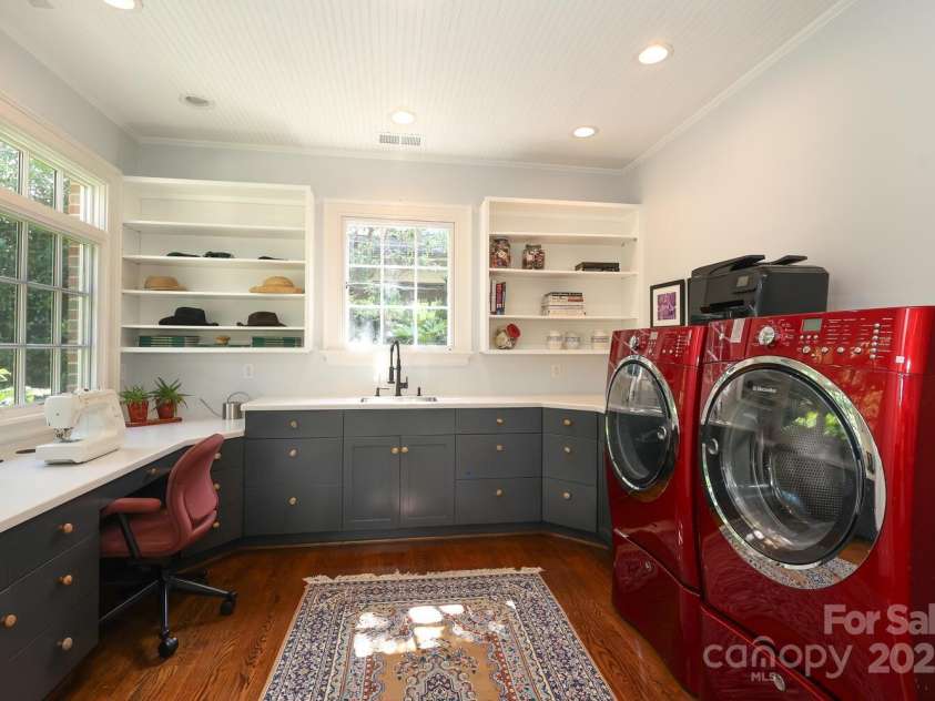 801 Berkeley Avenue, Charlotte, NC 28203.  MLS# CAR4243882, YatesRealty ID 16552. Generous laundry and craft room with wash sink and custom built ins.