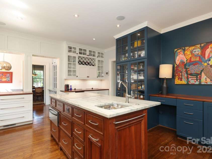801 Berkeley Avenue, Charlotte, NC 28203.  MLS# CAR4243882, YatesRealty ID 16552. Kitchen island with prep sink, built in desk and custom pantry storage
