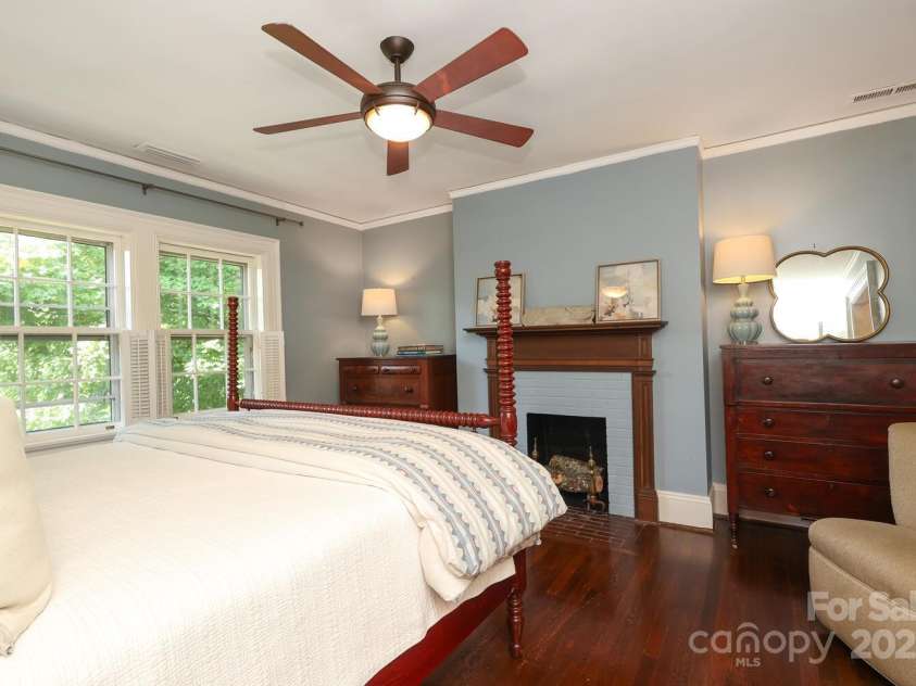 801 Berkeley Avenue, Charlotte, NC 28203.  MLS# CAR4243882, YatesRealty ID 16552. Primary bedoom with fireplace.