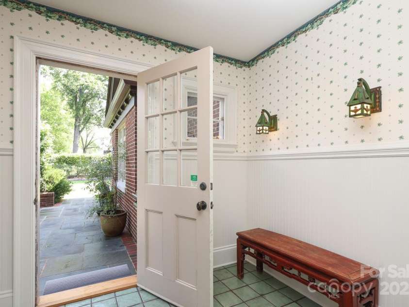 801 Berkeley Avenue, Charlotte, NC 28203.  MLS# CAR4243882, YatesRealty ID 16552. Secondary rear entry with view to terrace and grilling area