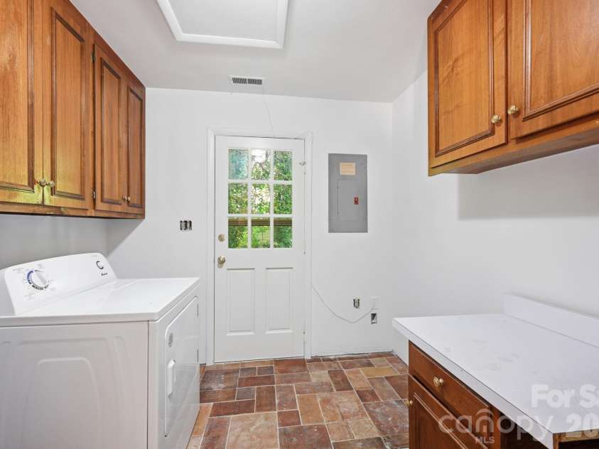 9701 Enid Lane, Matthews, NC 28105.  MLS# CAR4373941, YatesRealty ID 16557. Lower Level Laundry