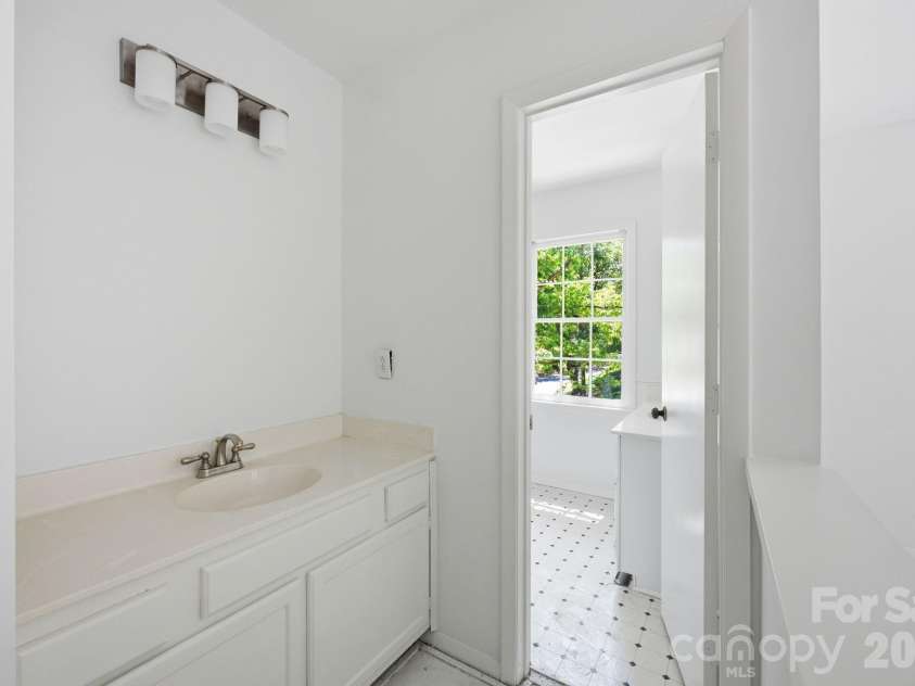 9701 Enid Lane, Matthews, NC 28105.  MLS# CAR4373941, YatesRealty ID 16557. Primary Bed Vanity