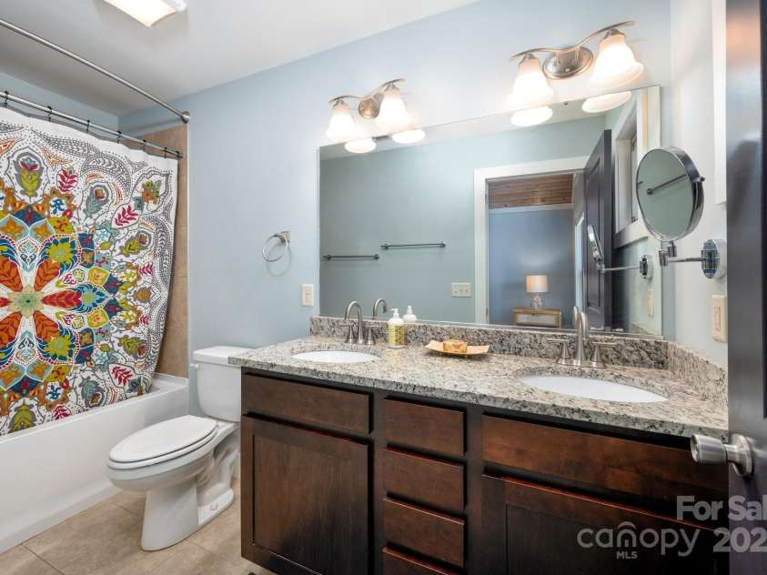 15 Gratitude Drive, Asheville, NC 28806.  MLS# CAR4254992, YatesRealty ID 16563. Double vanity in the primary en suite bathroom