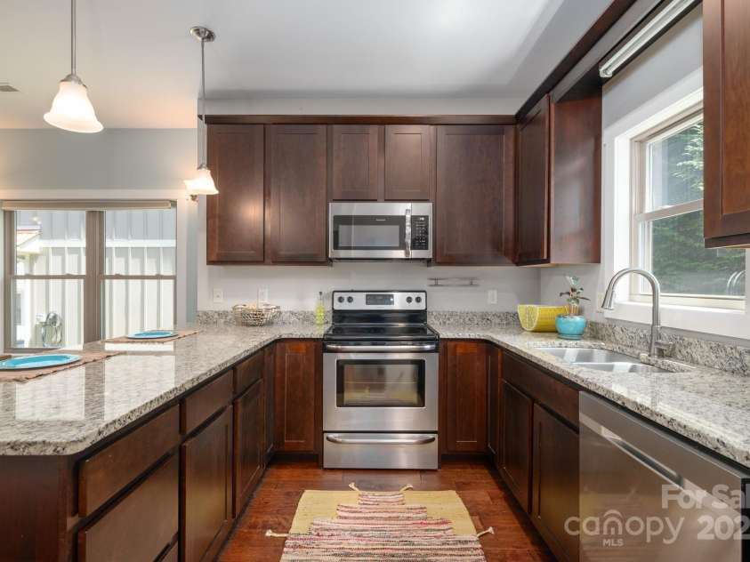 15 Gratitude Drive, Asheville, NC 28806.  MLS# CAR4254992, YatesRealty ID 16563. Stylish and functional kitchen with abundant storage