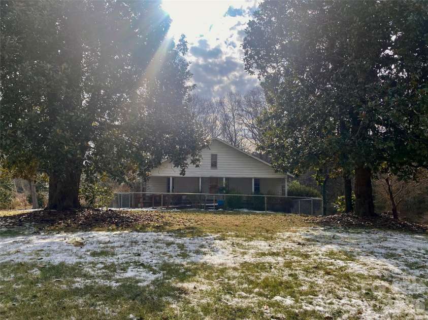 306 US Hwy 70A E Highway, Hildebran, NC 28637.  MLS# CAR4343164, YatesRealty ID 1657. MATURE MAGNOLIAS FRAME THIS HOME