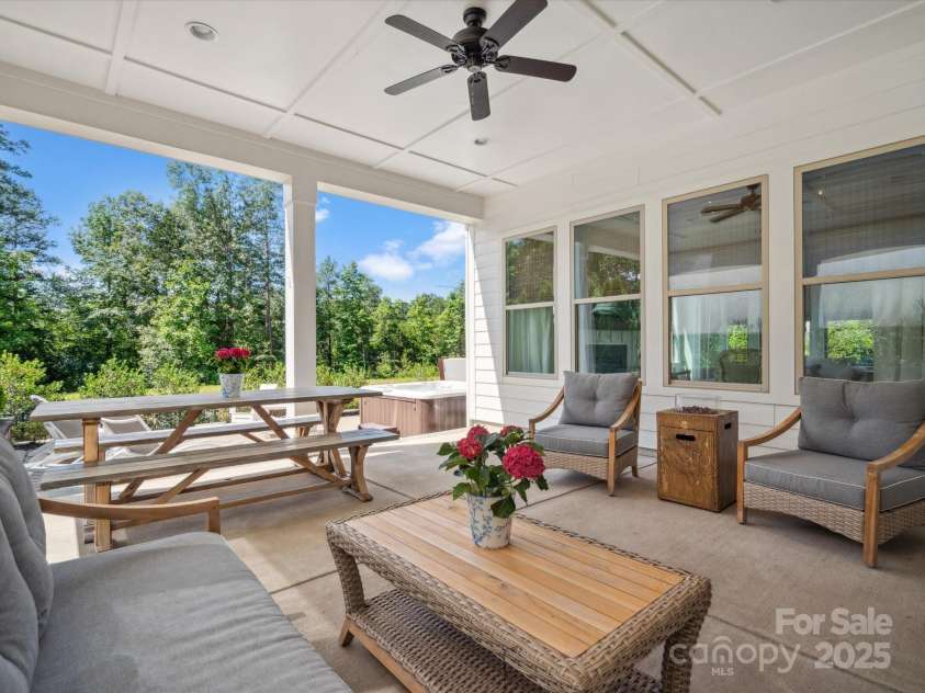 435 Galbreath Court, Fort Mill, SC 29708.  MLS# CAR4261565, YatesRealty ID 16571. Covered rear porch overlooks private rear yard