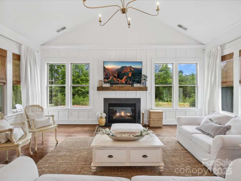 435 Galbreath Court, Fort Mill, SC 29708.  MLS# CAR4261565, YatesRealty ID 16571. Family room with custom accent wall and fireplace
