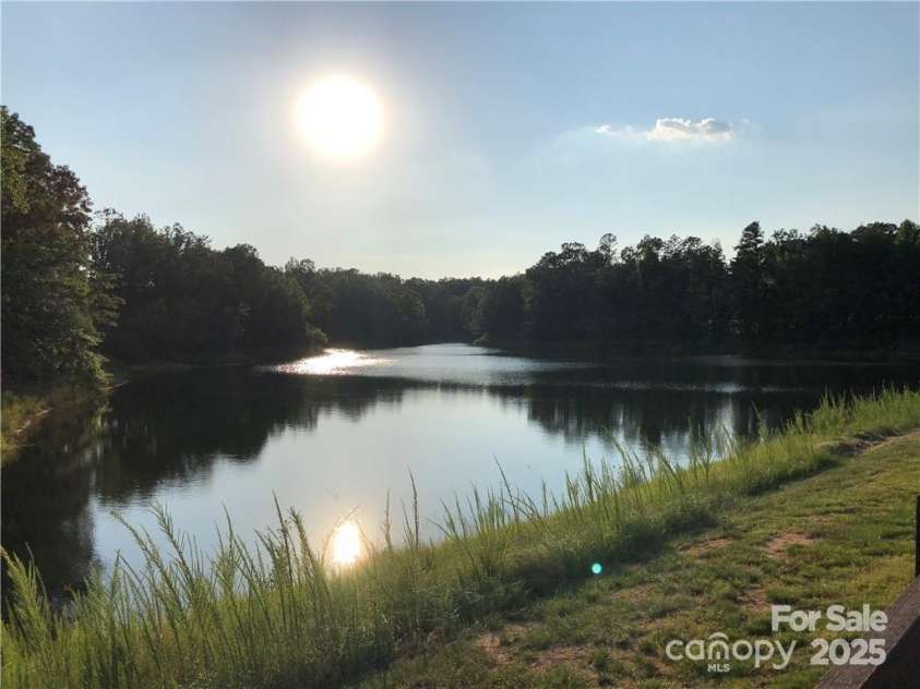 435 Galbreath Court, Fort Mill, SC 29708.  MLS# CAR4261565, YatesRealty ID 16571. Home backs to Gibson Pond. enjoy fishing, paddle boating, or walk the nature trail