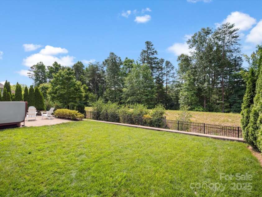 435 Galbreath Court, Fort Mill, SC 29708.  MLS# CAR4261565, YatesRealty ID 16571. Level rear yard, then step down to more yard and fire pit area